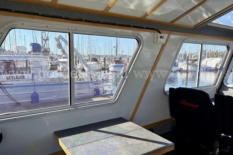 Slide: The Image of Interior view of 2019 Armstrong Marine 38 Monohull, overlooking marina with research vessel. - 28