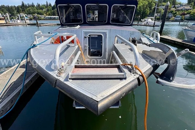 Slide: The Image of 2019 Armstrong Marine 38 Monohull docked at a marina, featuring sturdy railings and anchor. - 7