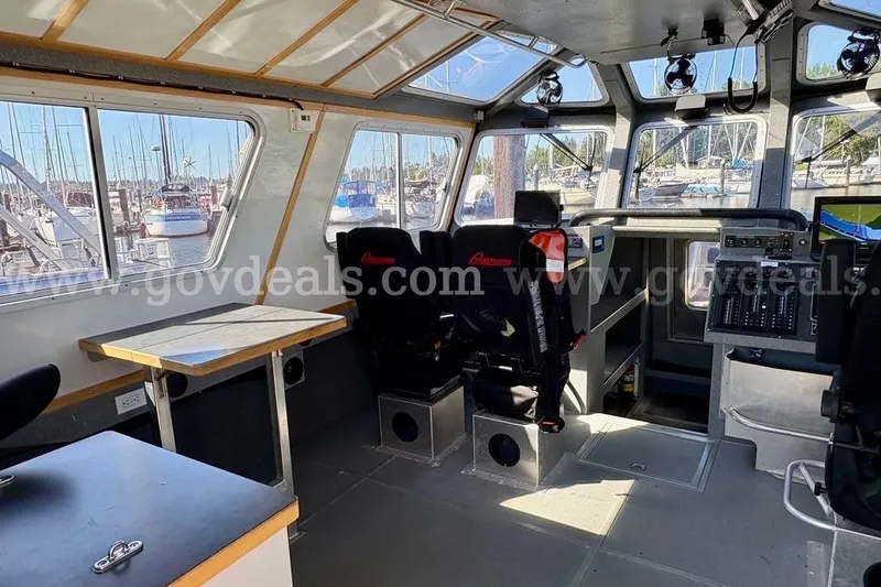Slide: The Image of Interior of 2019 Armstrong Marine 38 Monohull boat with control panel and seating. - 24
