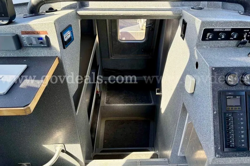 Slide: The Image of Interior view of 2019 Armstrong Marine 38 Monohull boat, featuring control panels and cabin entrance. - 41