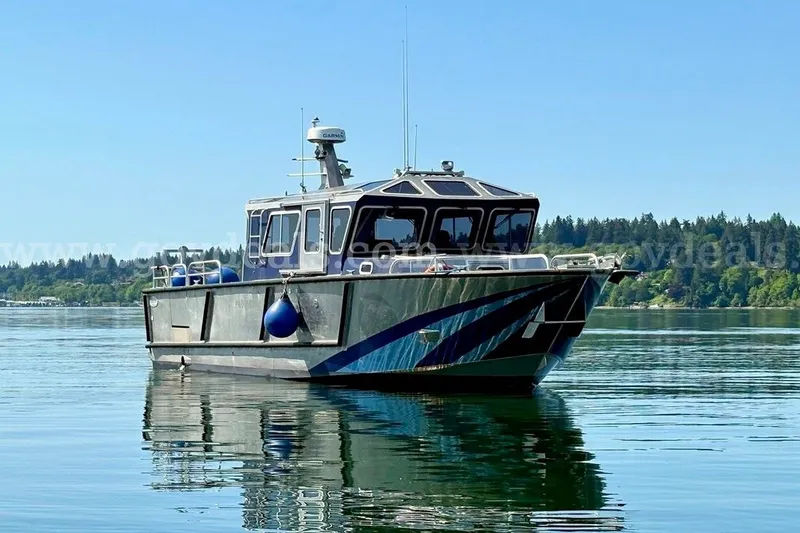 Slide: The Image of 2019 Armstrong Marine 38 Monohull boat on calm water with forested shoreline. - 4