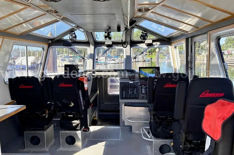Slide: The Image of Interior of 2019 Armstrong Marine 38 Monohull boat with seating and control panel. - 22