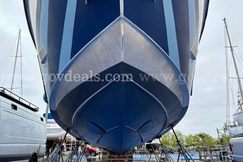 Slide: The Image of 2019 Armstrong Marine 38 Monohull boat in dry dock, blue hull, side view. - 59