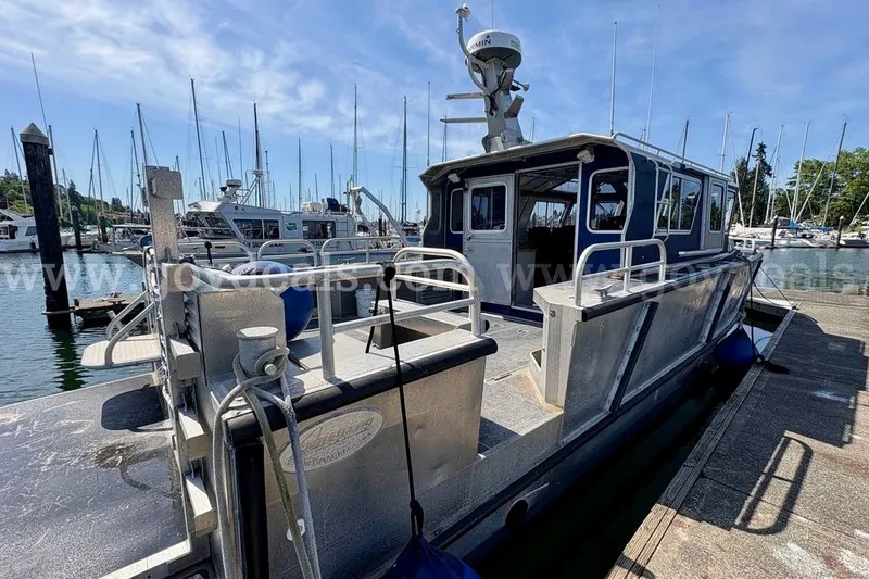 Slide: The Image of 2019 Armstrong Marine 38 Monohull docked at marina, surrounded by sailboats. - 8