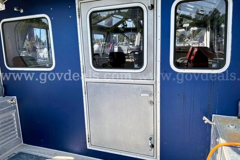 Slide: The Image of Blue exterior of 2019 Armstrong Marine 38 Monohull with metal door and windows. - 21