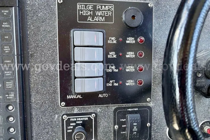 Slide: The Image of Control panel of a 2019 Armstrong Marine 38 Monohull, featuring bilge pump and heater controls. - 35