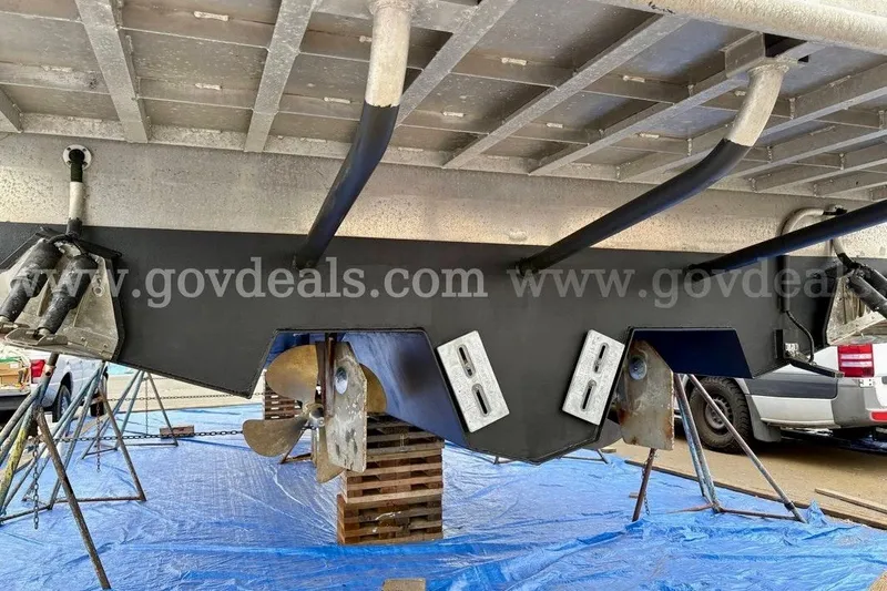 Slide: The Image of 2019 Armstrong Marine 38 Monohull boat underside with propellers and supports. - 60