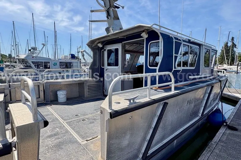 Slide: The Image of 2019 Armstrong Marine 38 Monohull docked at marina with clear sky background. - 9