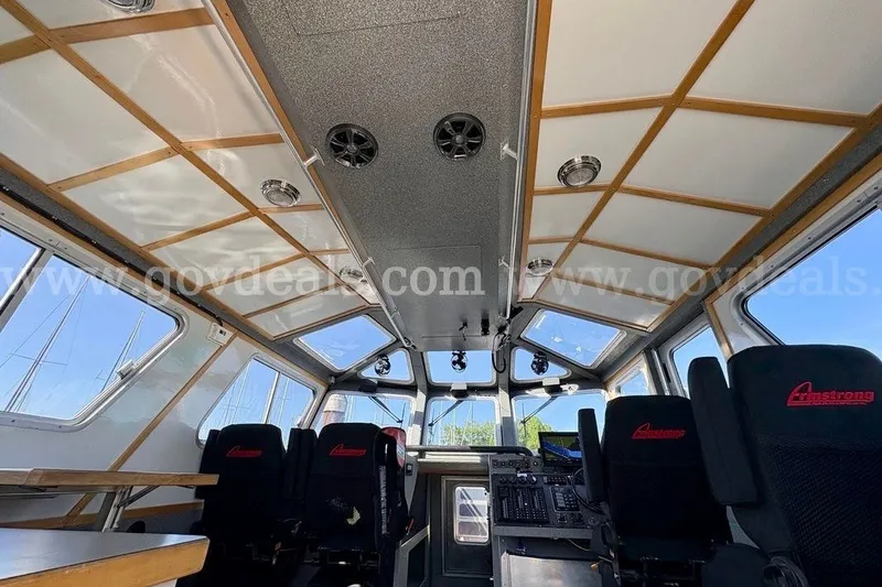 Slide: The Image of Interior of 2019 Armstrong Marine 38 Monohull boat, featuring seating and control panel. - 23