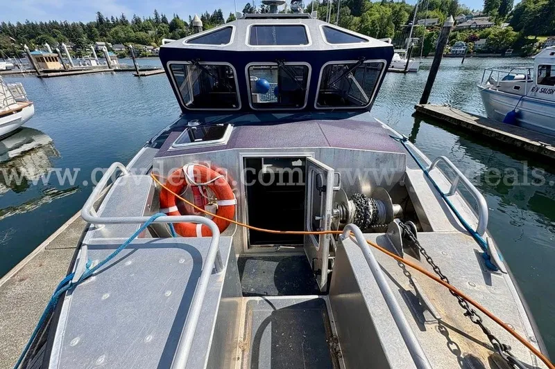 Slide: The Image of 2019 Armstrong Marine 38 Monohull docked, featuring deck equipment and safety gear. - 15