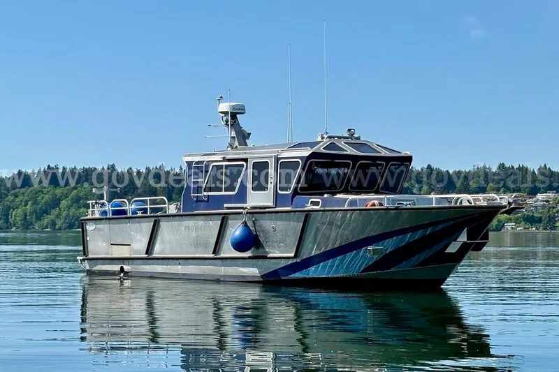 The Image of 2019 Armstrong Marine 38 Monohull boat on calm water, clear sky background. - 0