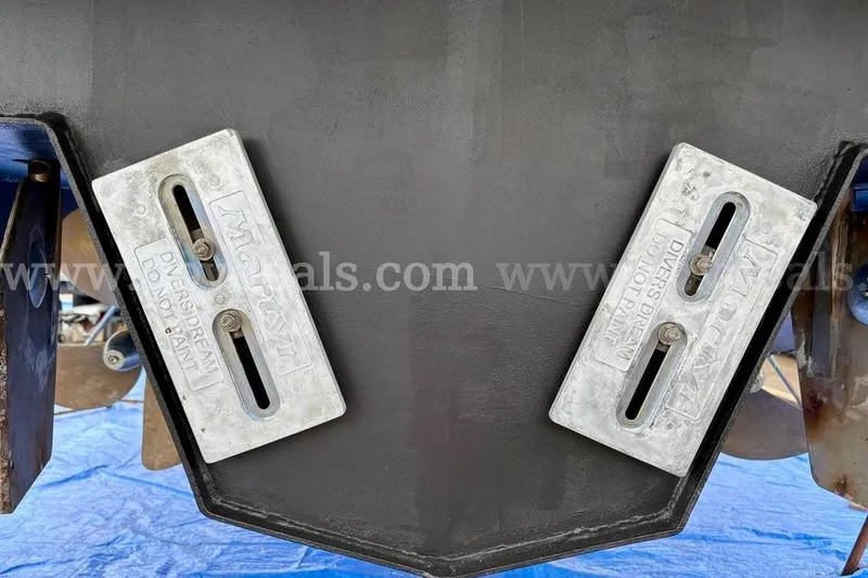 Slide: The Image of Close-up of Armstrong Marine 38 Monohull 2019 hull with anodes, on a blue tarp. - 54