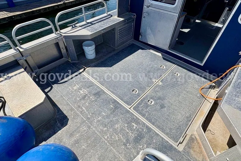 Slide: The Image of 2019 Armstrong Marine 38 Monohull boat deck with storage compartments and railing. - 12