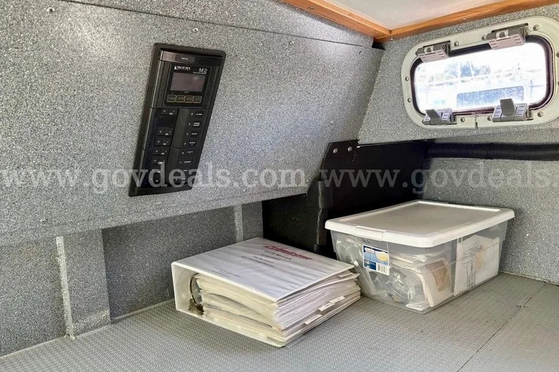 Slide: The Image of Interior of 2019 Armstrong Marine 38 Monohull with control panel and storage containers. - 44