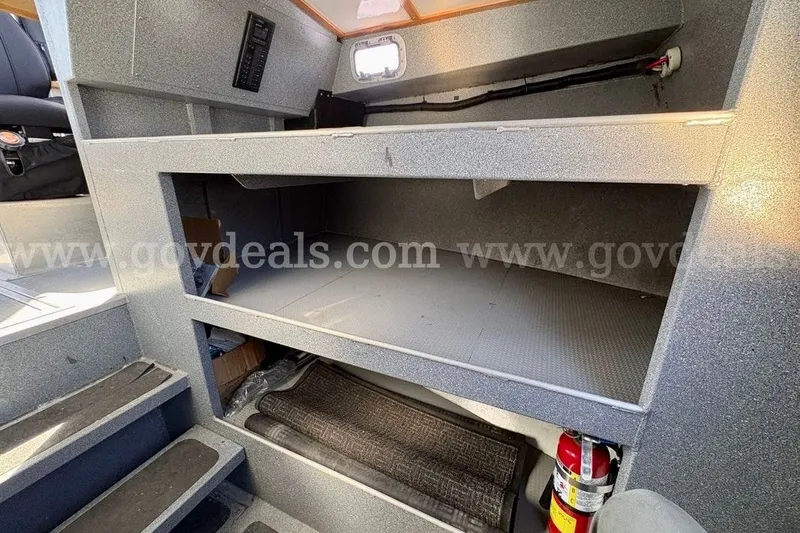 Slide: The Image of Interior view of 2019 Armstrong Marine 38 Monohull boat with storage and fire extinguisher. - 43
