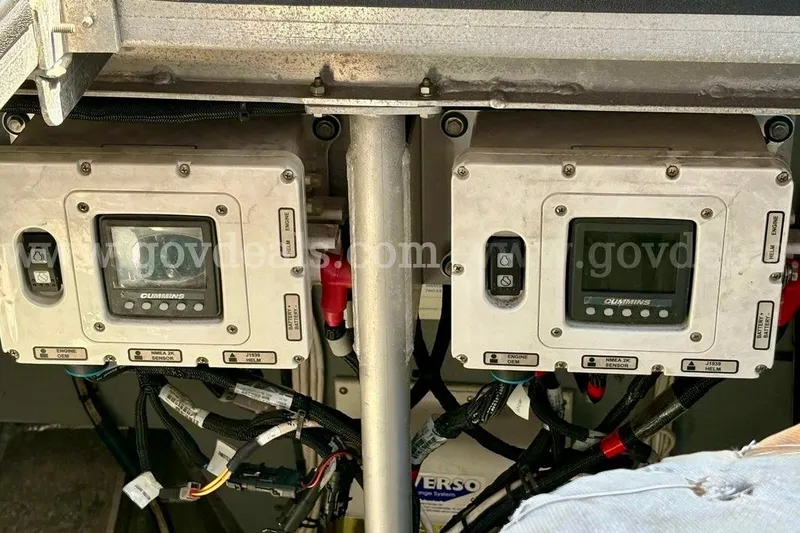 Slide: The Image of Control panels of a 2019 Armstrong Marine 38 Monohull boat, featuring Cummins displays. - 62