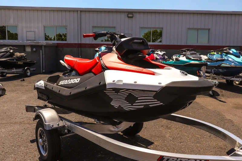 The Image of 2026 Sea-Doo Spark Trixx for 3 on trailer, parked outdoors. - 1