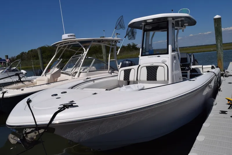 The Image of 2023 Tidewater 232 SS boat docked, featuring sleek design and modern amenities. - 0