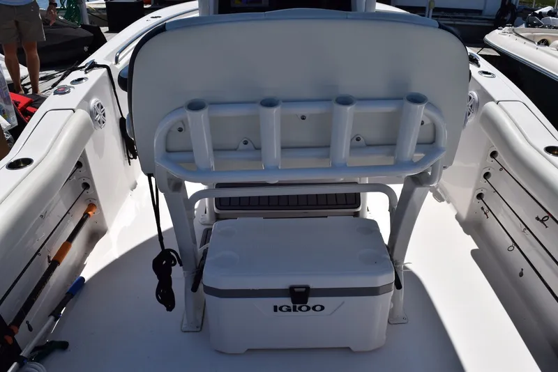 Slide: The Image of 2023 Tidewater 232 SS boat interior with rod holders and Igloo cooler. - 14