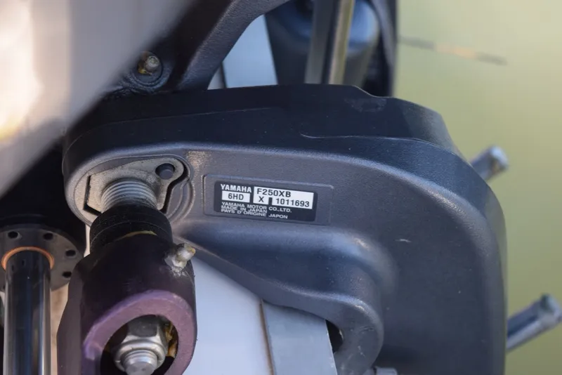 Slide: The Image of Close-up of Yamaha F250XB engine part on 2023 Tidewater 232 SS boat. - 17