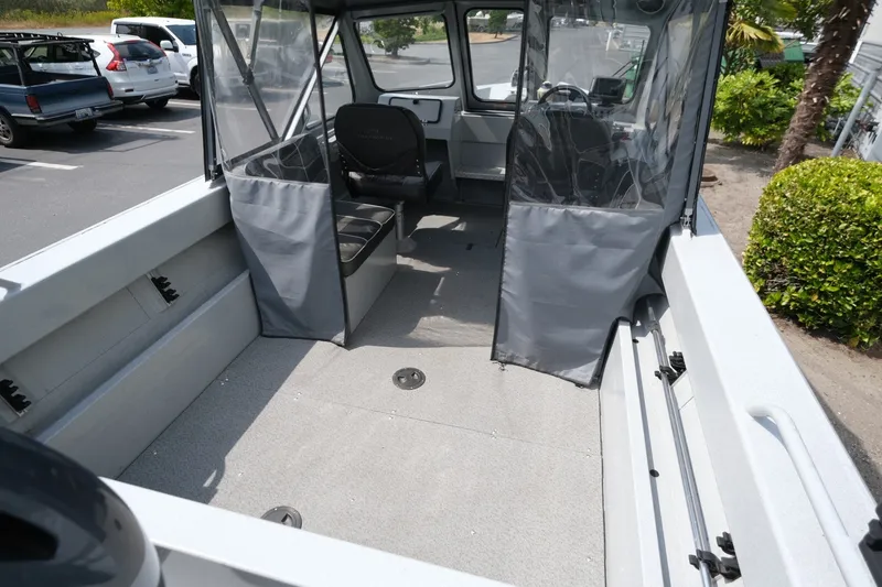 Slide: The Image of 2018 Duckworth 18 Advantage Outboard boat interior with seating and clear vinyl doors. - 6