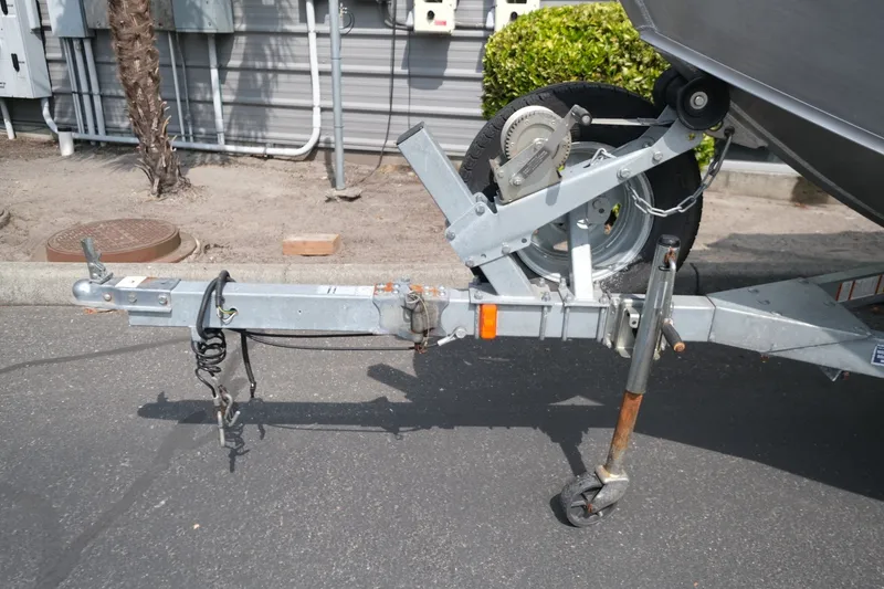 Slide: The Image of Trailer hitch of a 2018 Duckworth 18 Advantage Outboard boat on pavement. - 13
