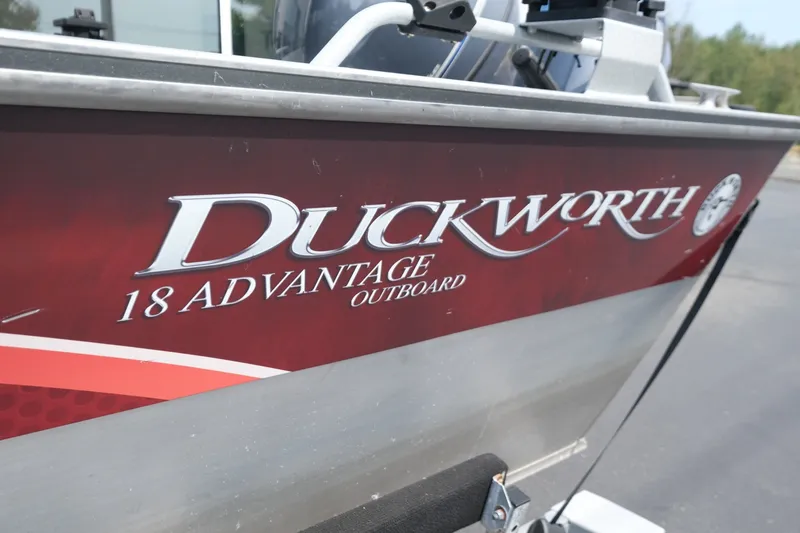 Slide: The Image of 2018 Duckworth 18 Advantage Outboard boat with red and silver detailing. - 16