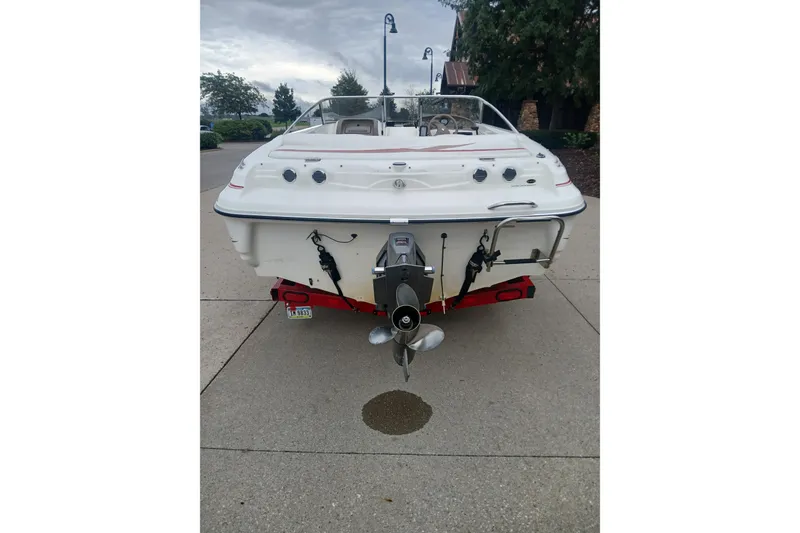 Slide: The Image of Rear view of a 2003 Larson SEi 180 boat on a trailer. - 7