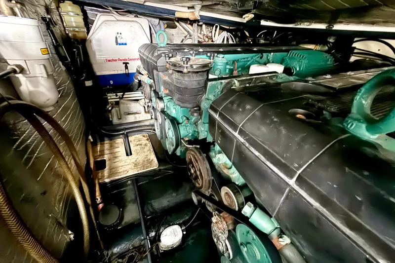 Slide: The Image of Engine room of a 2005 Cranchi Endurance 41 yacht, showcasing machinery and components. - 41
