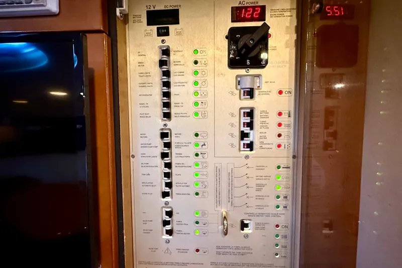 Slide: The Image of Electrical control panel on a 2005 Cranchi Endurance 41 yacht, displaying various switches and indicators. - 36