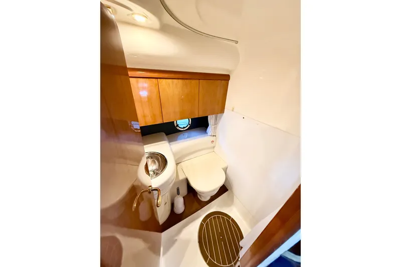 Slide: The Image of Luxurious bathroom in 2005 Cranchi Endurance 41 yacht with wooden cabinetry and modern fixtures. - 31