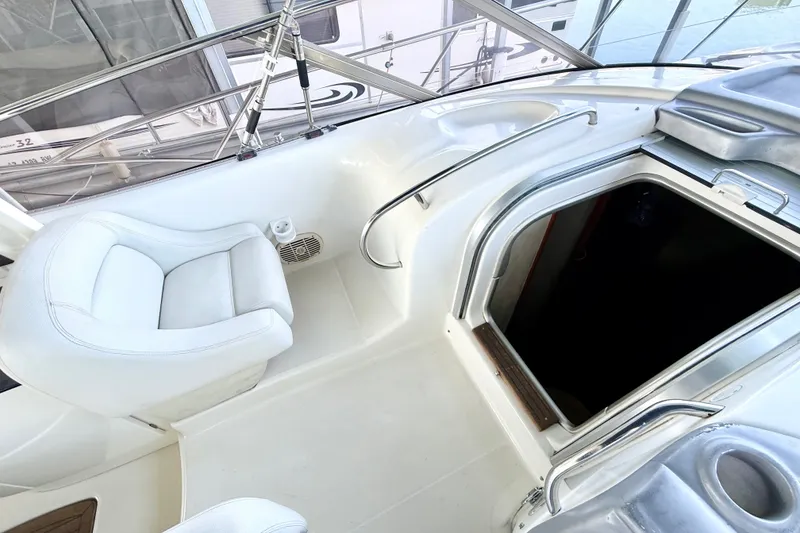 Slide: The Image of 2005 Cranchi Endurance 41 yacht interior with white seating and open cabin hatch. - 10