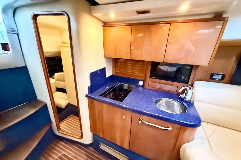 Slide: The Image of Luxurious 2005 Cranchi Endurance 41 yacht interior with kitchenette and seating area. - 25