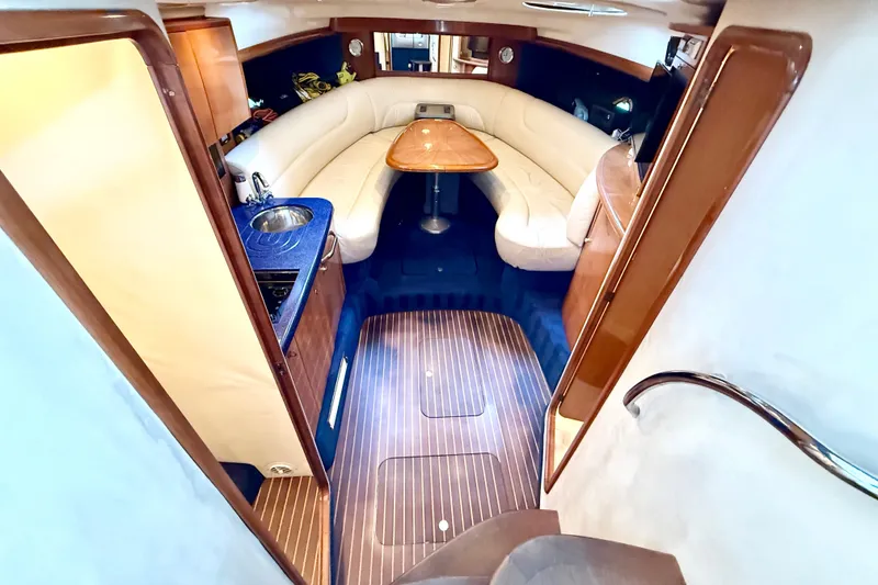 Slide: The Image of Luxurious interior of 2005 Cranchi Endurance 41 yacht with elegant seating and kitchenette. - 22