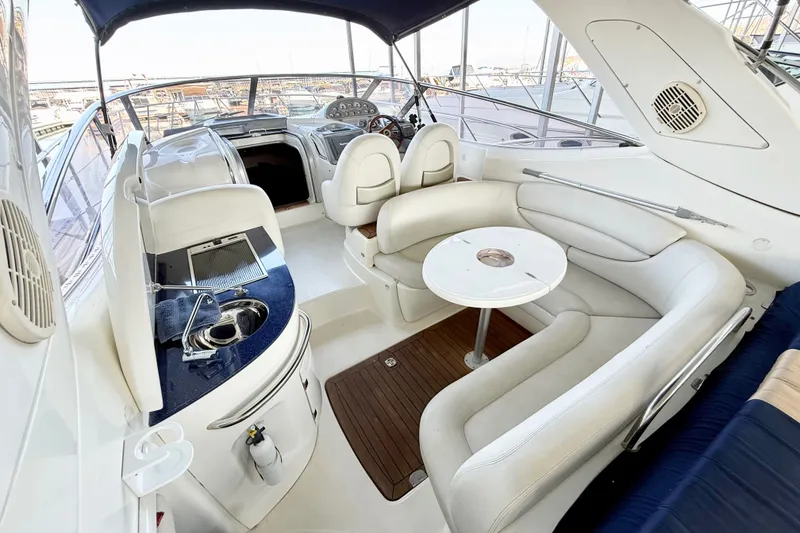 Slide: The Image of Luxurious 2005 Cranchi Endurance 41 yacht interior with plush seating and sleek design. - 4