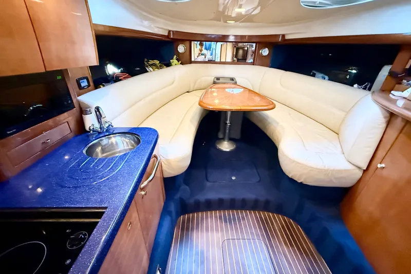 Slide: The Image of Luxurious interior of 2005 Cranchi Endurance 41 yacht with elegant seating and kitchenette. - 26