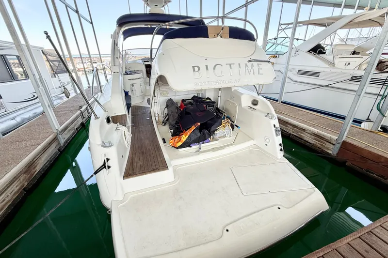 Slide: The Image of 2005 Cranchi Endurance 41 yacht docked, featuring spacious deck and storage area. - 2