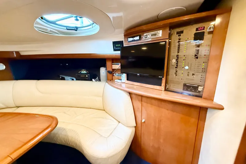 Slide: The Image of 2005 Cranchi Endurance 41 yacht interior with leather seating, control panel, and TV. - 23