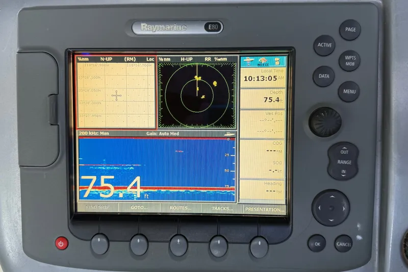 Slide: The Image of Raymarine E80 navigation display on 2005 Cranchi Endurance 41 showing depth and coordinates. - 12