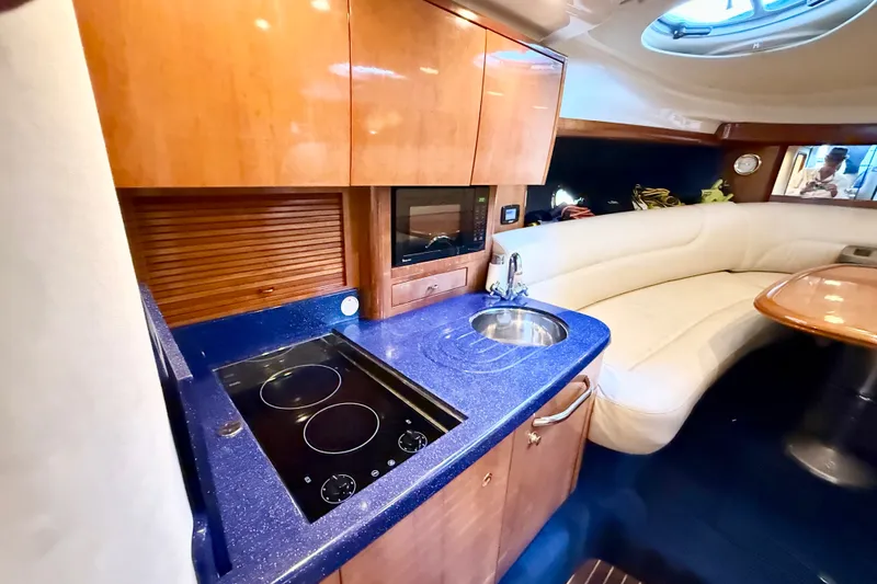 Slide: The Image of Luxurious 2005 Cranchi Endurance 41 yacht interior with modern kitchen and cozy seating area. - 27