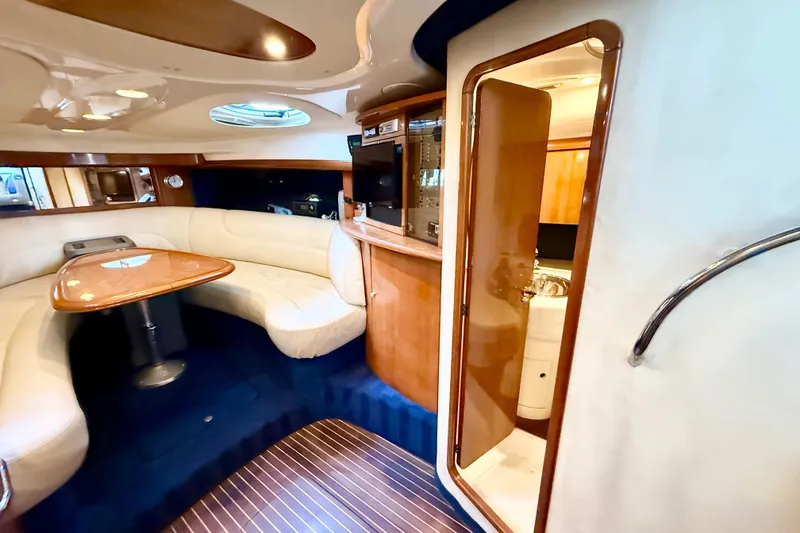 Slide: The Image of Luxurious interior of 2005 Cranchi Endurance 41 yacht with elegant seating and wooden finishes. - 28