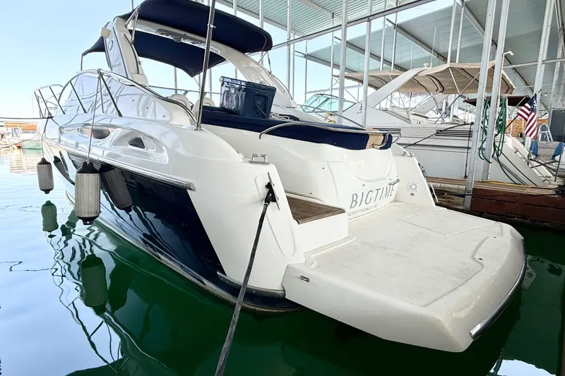 Slide: The Image of 2005 Cranchi Endurance 41 yacht docked in a marina, rear view. - 1