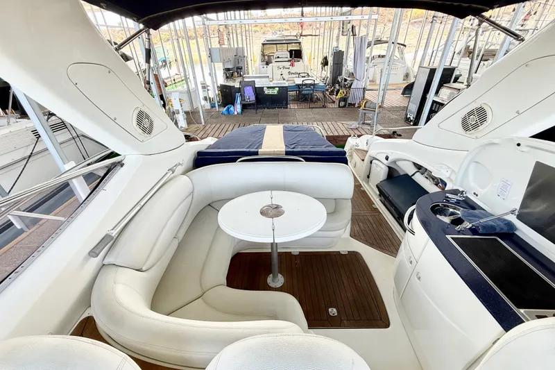 Slide: The Image of Luxurious 2005 Cranchi Endurance 41 yacht interior with white seating and compact kitchenette. - 3