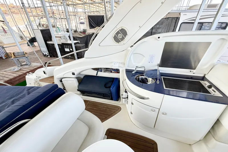 Slide: The Image of 2005 Cranchi Endurance 41 yacht interior with kitchenette and seating area. - 7