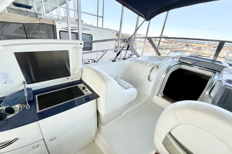 Slide: The Image of 2005 Cranchi Endurance 41 yacht interior with kitchenette and seating area. - 5
