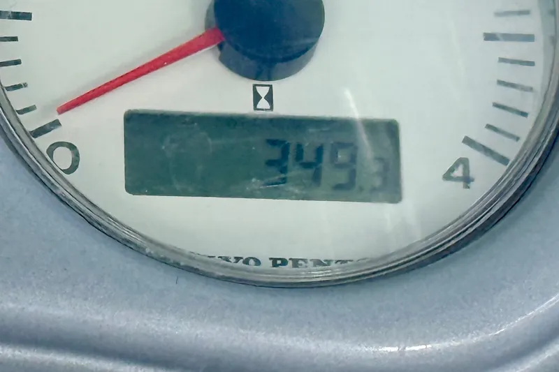 Slide: The Image of Close-up of a Volvo Penta gauge displaying 349.3 hours on a 2005 Cranchi Endurance 41. - 43