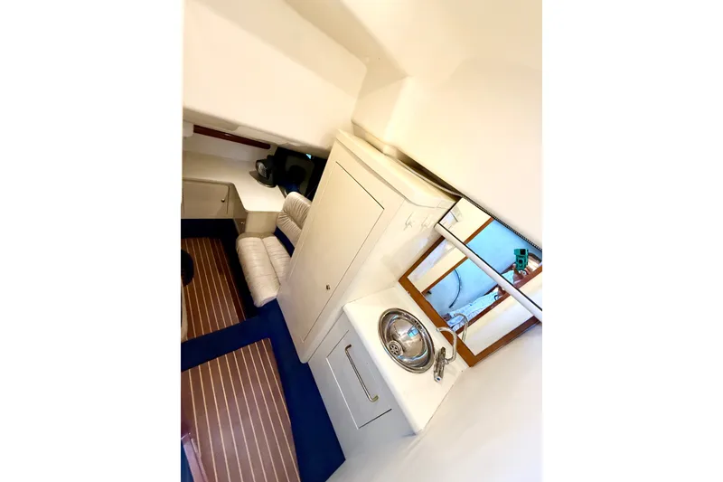 Slide: The Image of Interior of 2005 Cranchi Endurance 41 yacht with sink and seating area. - 30