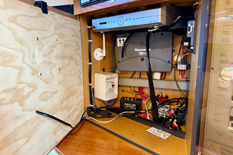 Slide: The Image of Electrical panel inside a 2005 Cranchi Endurance 41 boat, featuring Raymarine equipment. - 40