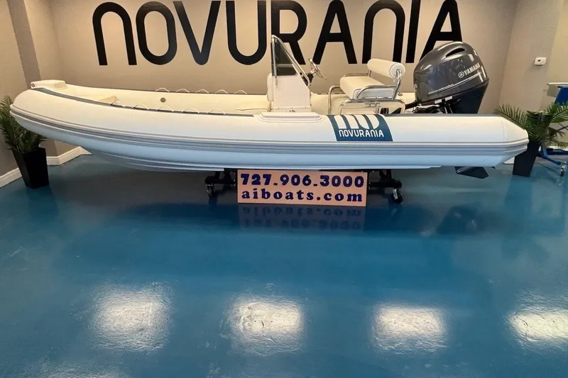 The Image of 2026 Novurania DL 550 boat displayed indoors with Yamaha engine. - 0