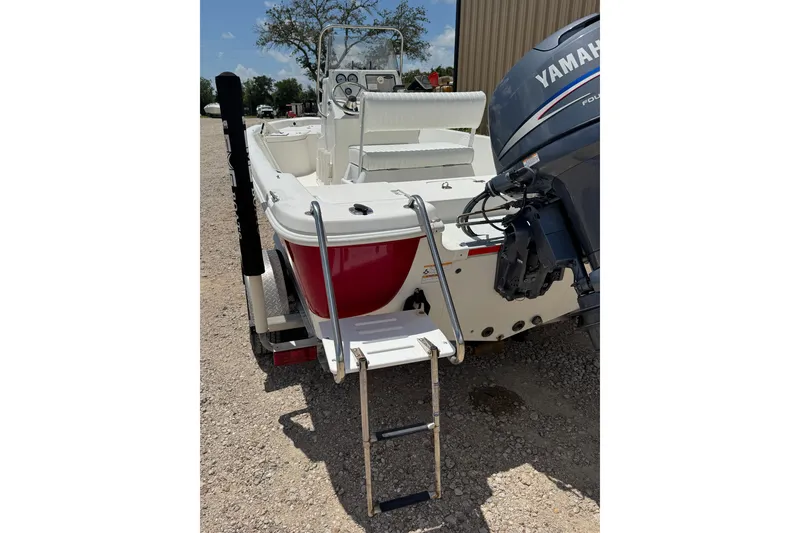 Slide: The Image of 2009 NauticStar 1810 NauticBay boat with Yamaha engine and ladder on trailer. - 14